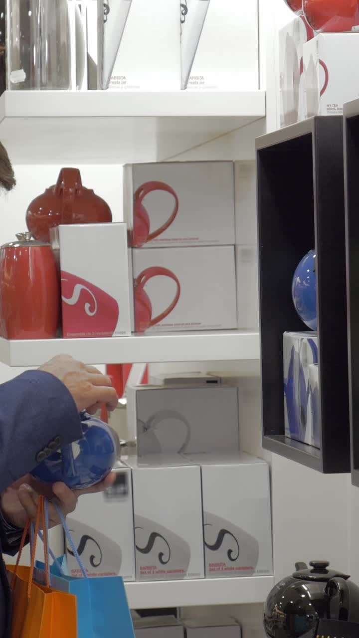 Shopper's Hands Examining a Blue Product in a Retail Store
