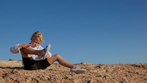 little girl playing on rocks