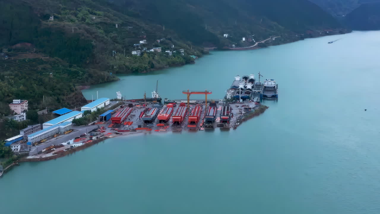Close view shipyards steel industry port vessel factory real shot, construction of a large ship on a shipyard with cranes. A fragment of the case in the workshop of plant. Metal frame during assembly