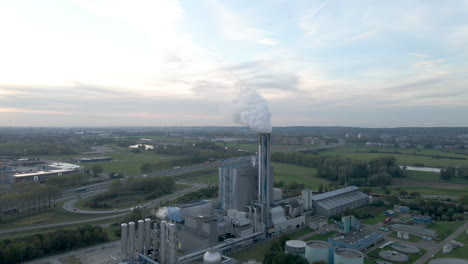 Aerial-overview-of-smoking-factory-scimney-in-rural-area