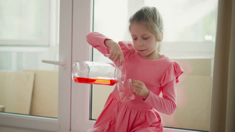 girl pouring juice