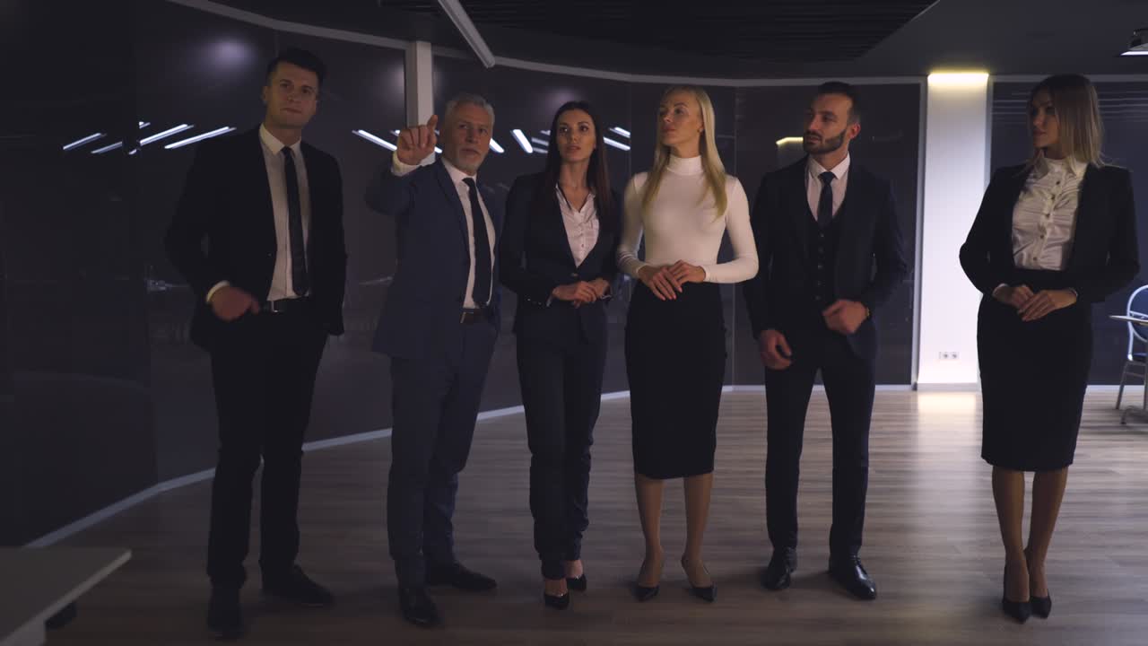 The business team of six working on a virtual screen