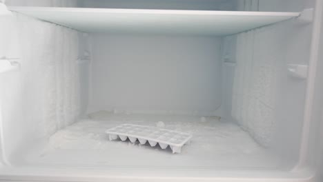 empty refrigerator freezer with frost