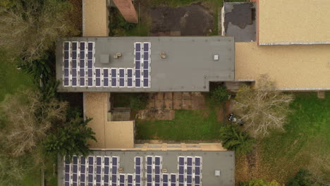 flying over city area - solar panel on roof