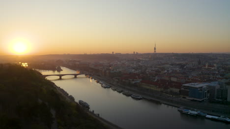 sunrise over prague city centre and vltava river,czechia,view from letná park