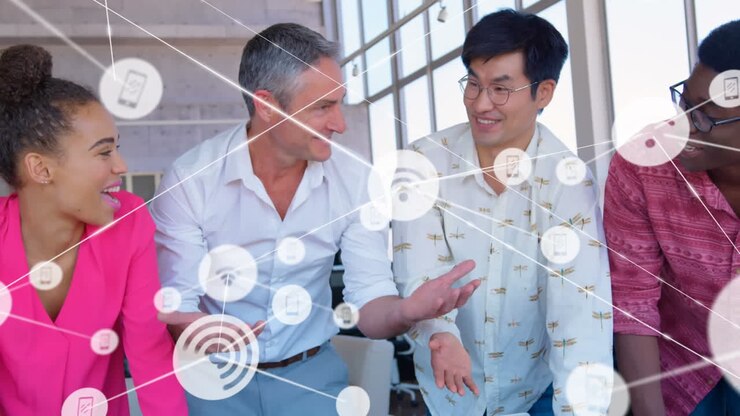 Animation of network of digital icons over diverse colleagues discussing together at office