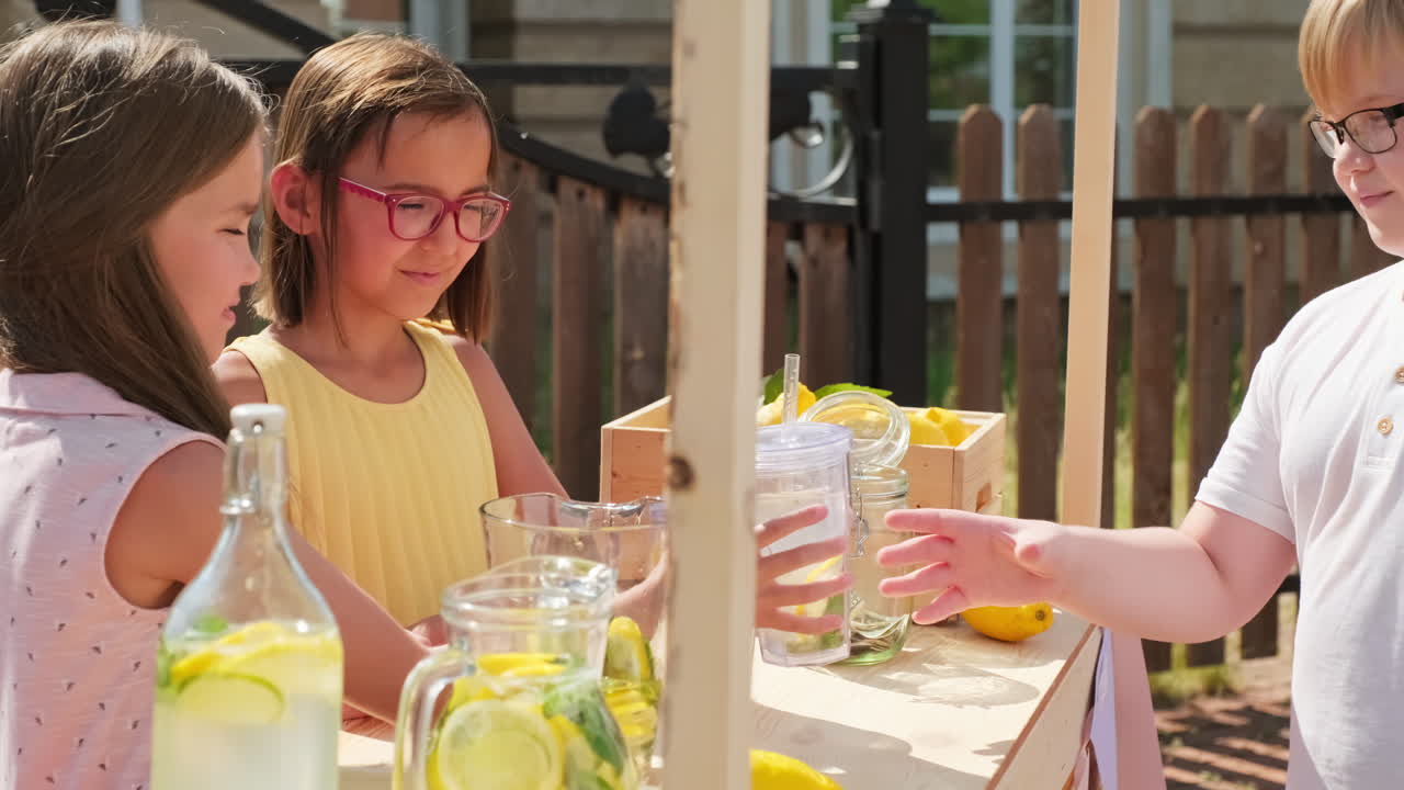 Girls Selling Lemonade To Boy