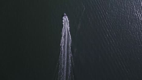 Speedboat-Cruising-At-Princess-Louisa-Inlet-Leaving-Wake-In-The-Waters-In-BC,-Canada