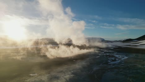 drone shot of hverir steam fields in iceland during winter in the morning