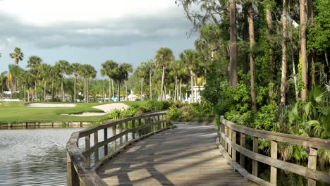 boardwalk to a golf course and pool at a resort in florida