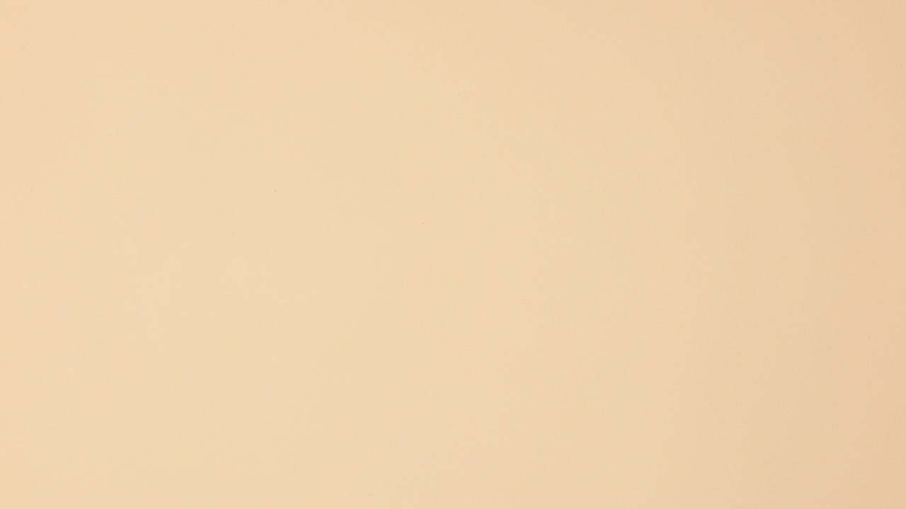 Manicure nail polishes bottles different colors make copy space circle on beige background. Stop motion flat lay