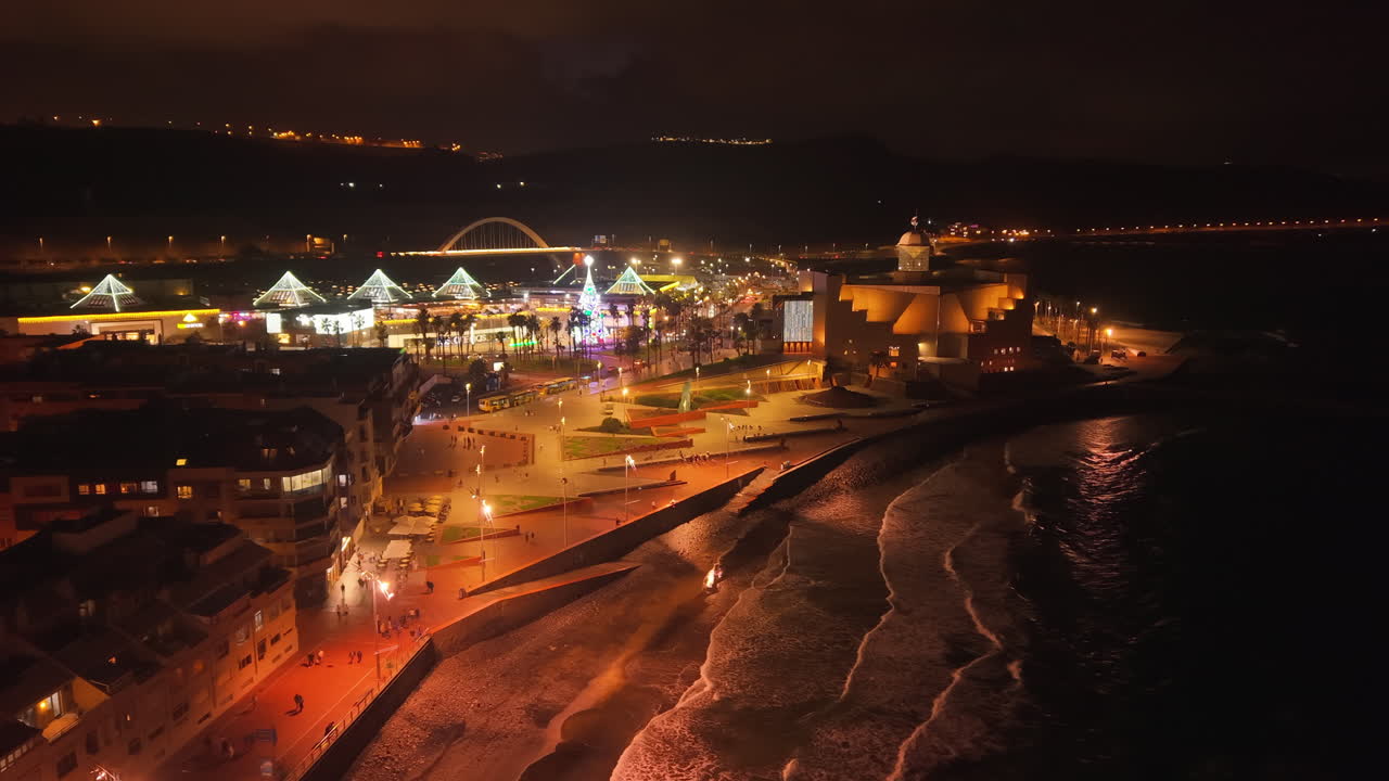 Aerial view of the Alfredo Kraus Auditorium and Las Canteras beach with christmas lights at night. Las Palmas city. Gran Canaria
