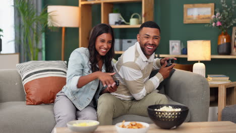 couple enjoying video games at home