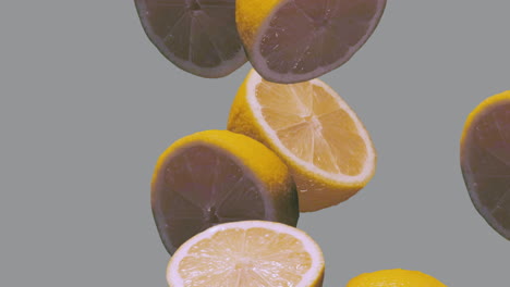 limones cayendo en cámara lenta sobre fondo gris, iluminando el color amarillo y gris definitivo del año 2021