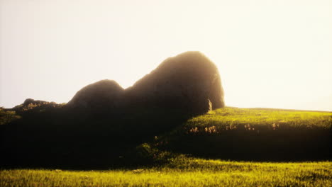 sunset over a rocky hill