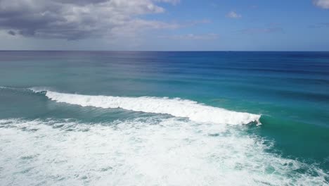 High-aerial-perspective-of-large-crashing-wave-and-white-wash-spreading