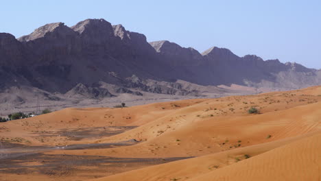 fossil rock mountain ridge against blue sky in sharjah, united arab emirates, dubai