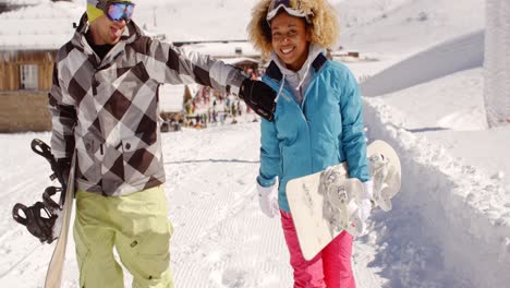 young couple walking in heavy winter snow