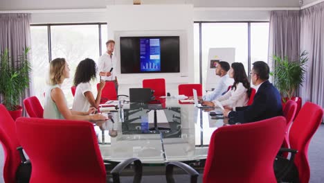 professional businessman giving presentation in meeting room in modern office in slow motion