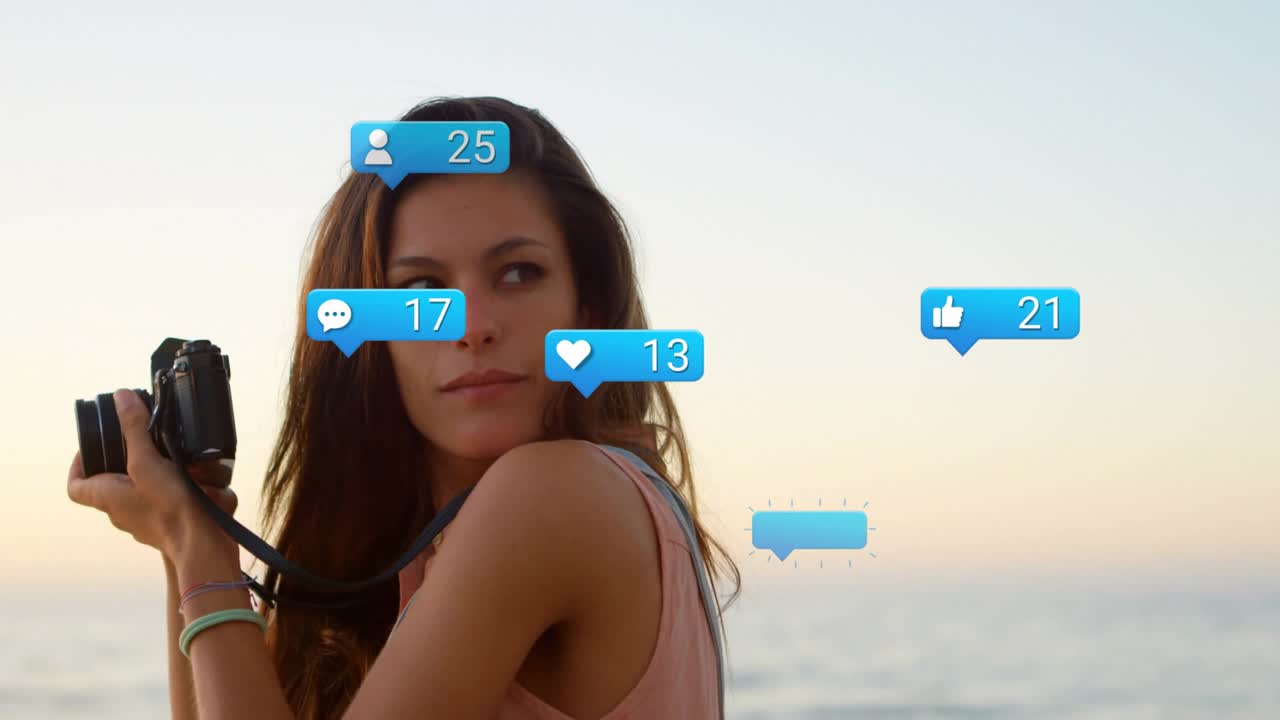 Social media creator raising camera shore, spawning blue bubbles rising counts capturing sunset