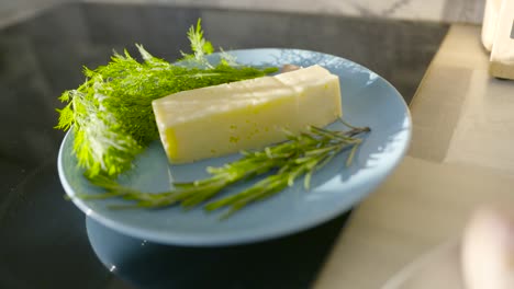 preparing a roasted chicken with lemon and herbs