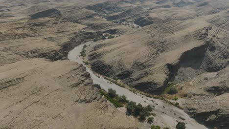 Dried-Up-Riverbed-in-Namib-Desert-Canyon,-Africa---Aerial