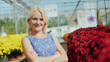 successful woman in a greenhouse