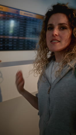 woman waiting at an airport terminal