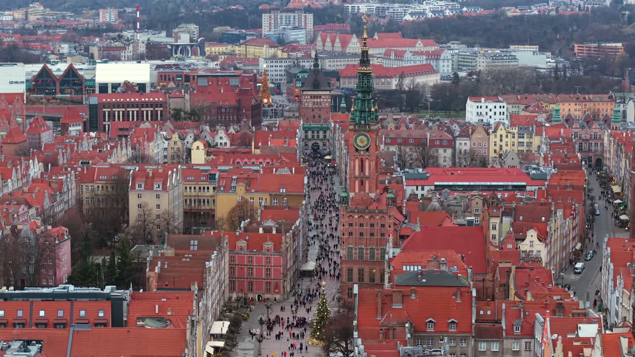 Crowds stroll Dluga Street in Gdansk, mix of locals and curious tourists