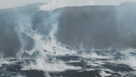 rising steam from cooling lava field