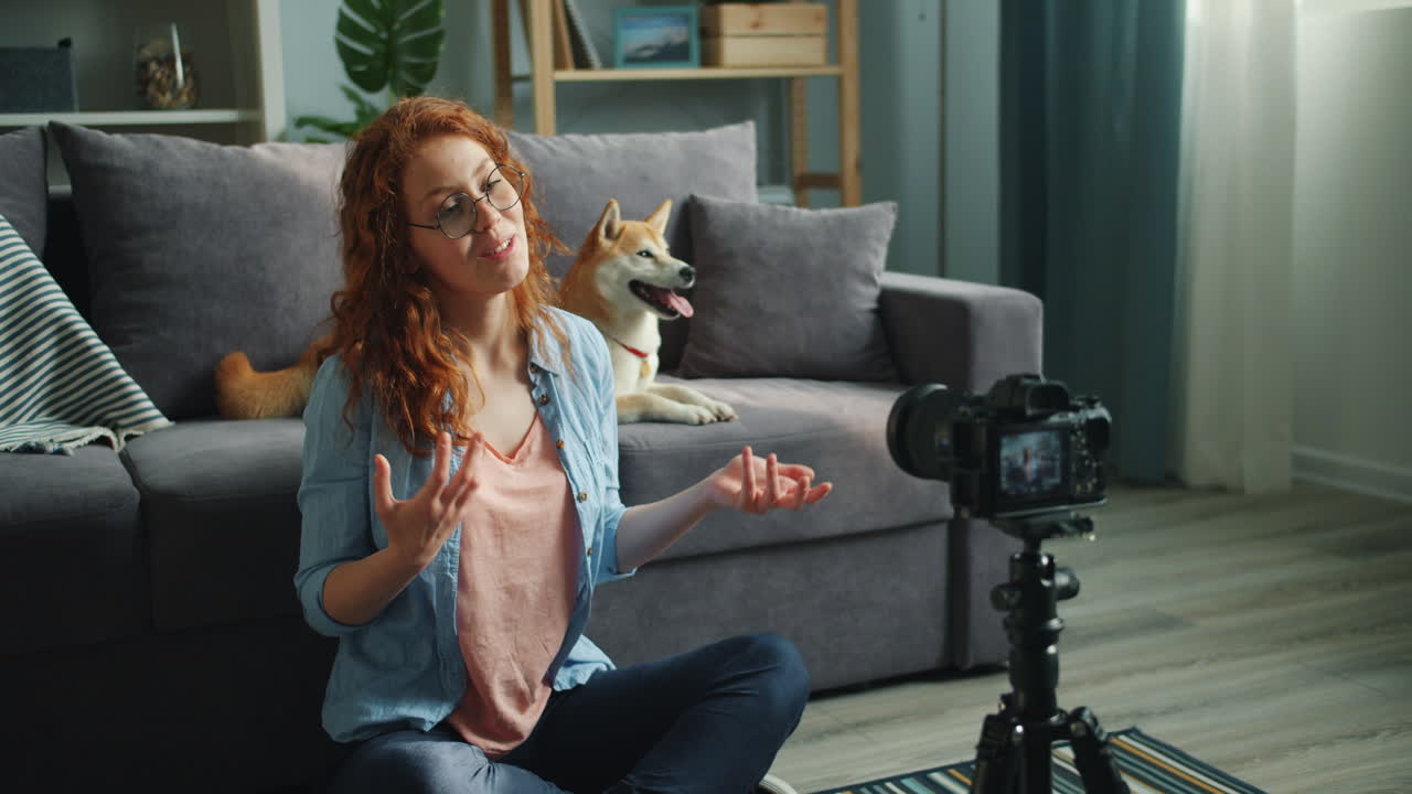 Woman Vlogger Recording Video with Dog in Living Room