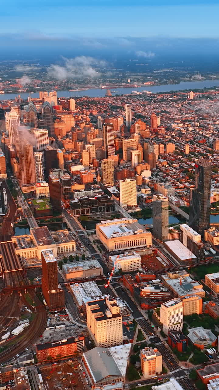 Two rivers crossing the beautiful cityscape. Diverse panorama of wonderful Philadelphia, USA. Aerial perspective. Vertical video