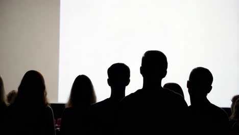 audience watching a movie in a theater