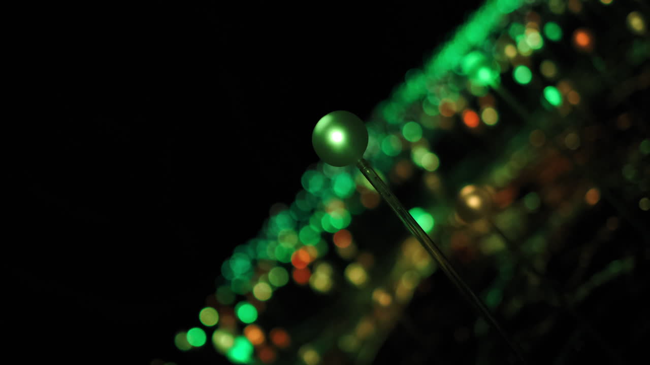 Rotating shot inside a dark room full of green light bulbs. Abstract art