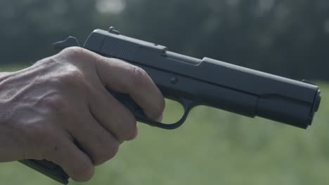 a colt forty five pistol firing in slow motion