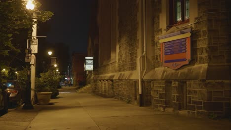 baltimore avenue sidewalk, night, outside cavalry church and curio theater