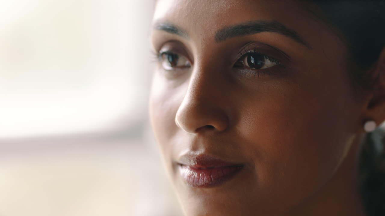 Close Up of Thoughtful Young Woman Looking Away