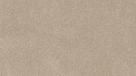 Camera slowly zooms into dense brown fibers, highlighting detailed weave