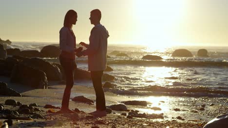 couple interactng with each other near sea 4k