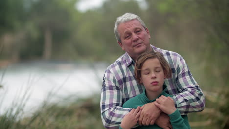 Portrait-of-grandfather-and-grandson-in-the-countryside