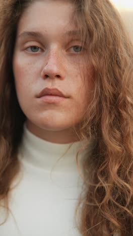 close-up portrait of a woman with curly hair