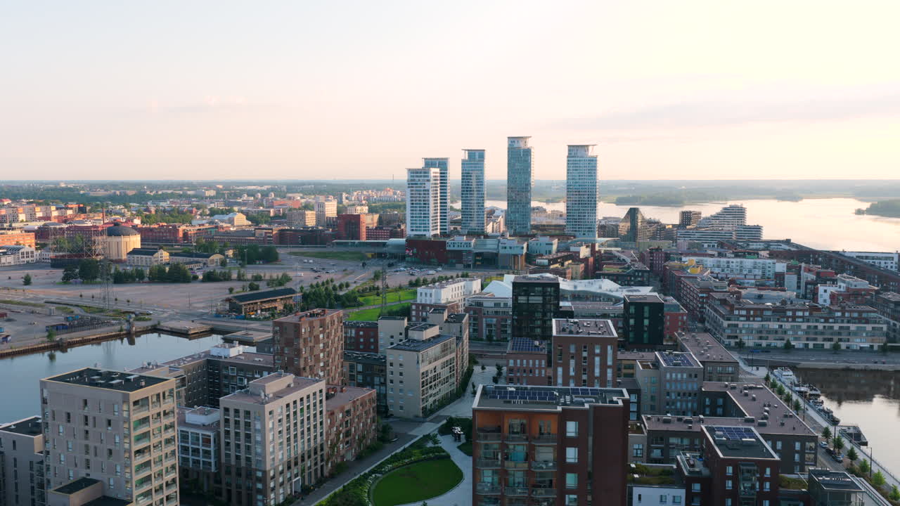 Aerial view rotating in front of the Redi mall, sunrise in Kalasatama, Helsinki
