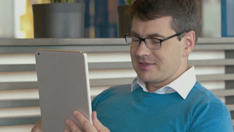 man having a business talk via pad video chat