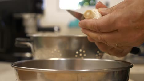 Cutting-Champignon-Mushroom,-Close-Up,-Slowmo