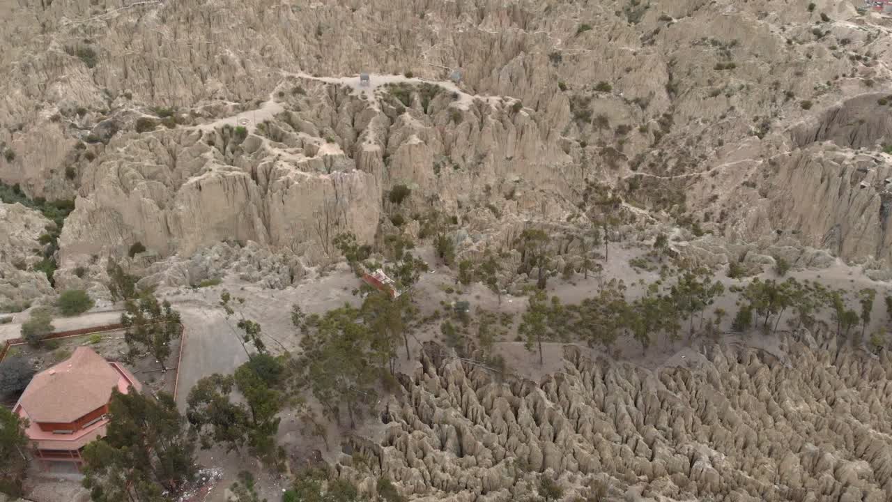 Aerial flyover of Moon Valley at La Paz Bolivia shows erosion hoodoos