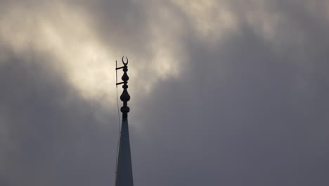 mosque minaret and balcony, moving clouds in the background, clouds and mosque minaret,