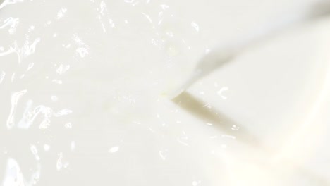 super slow motion of pouring steamed fresh milk into a glass frothed milk mixed milk closeup super slow motion of pouring steamed fresh milk into a glass frothed milk mixed milk closeup video macro shooting