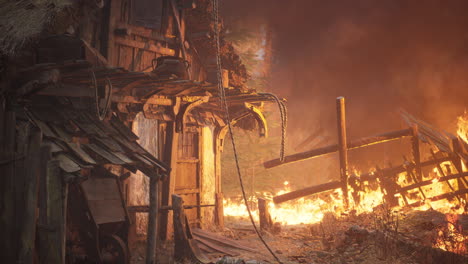 burning wooden house in old village