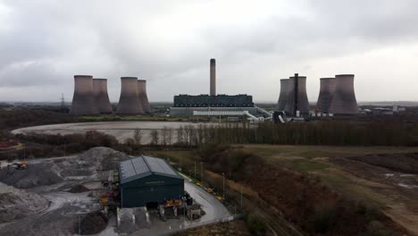 aerial descending view across coal fired power station site, fiddlers ferry overcast smokestack skyline