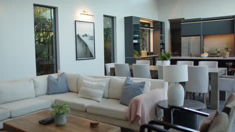 modern living room with cozy sofa, dining table, and stylish kitchen in background, copy space